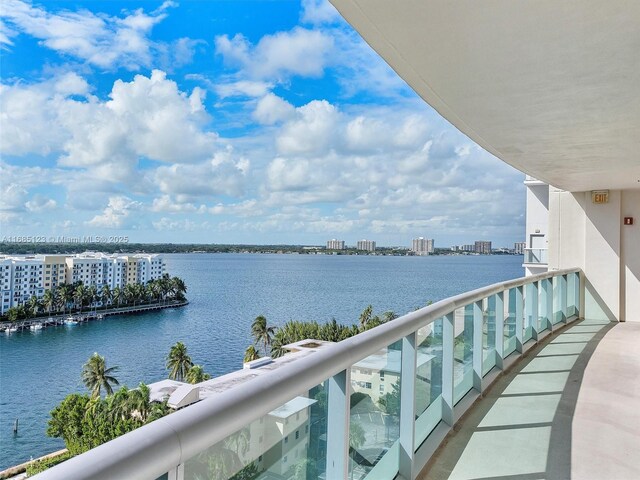 balcony featuring a water view