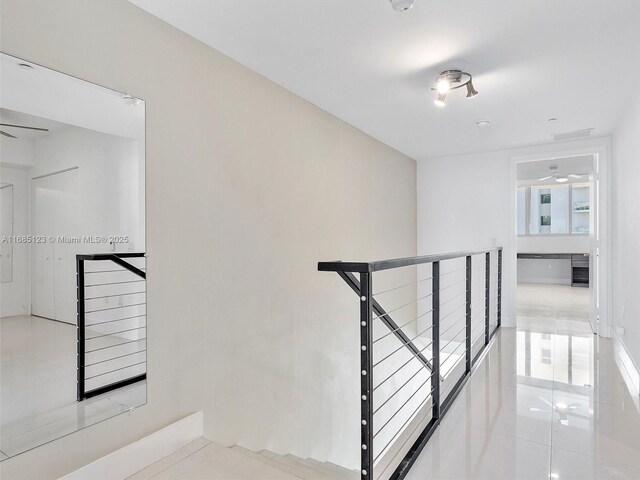 stairs featuring tile patterned flooring