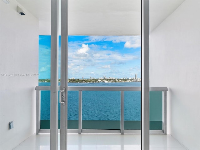 balcony featuring a water view