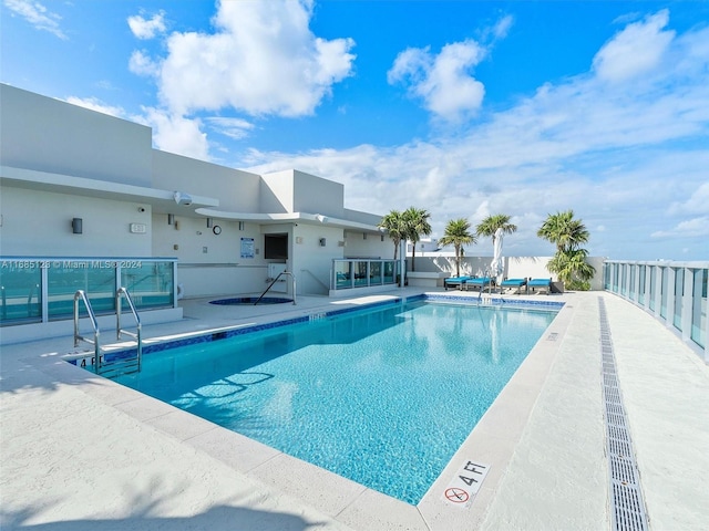 view of swimming pool featuring a patio