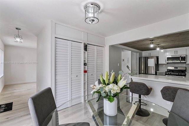 dining space featuring light hardwood / wood-style flooring