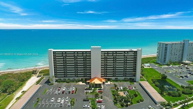 bird's eye view featuring a water view and a view of the beach