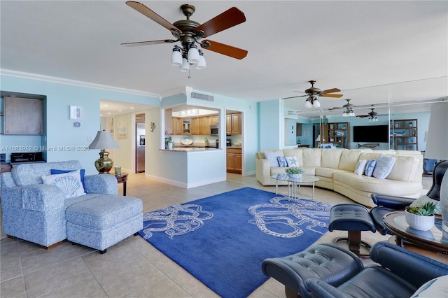 tiled living room featuring ornamental molding and ceiling fan