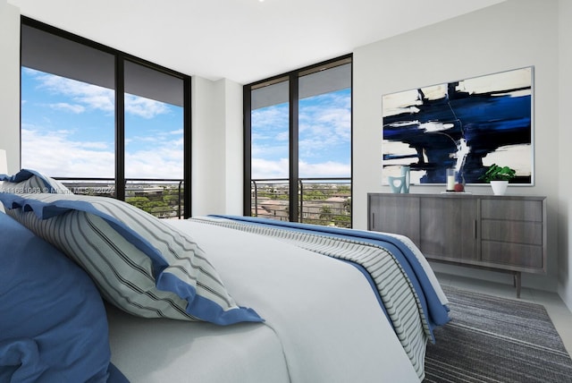 bedroom with multiple windows and floor to ceiling windows