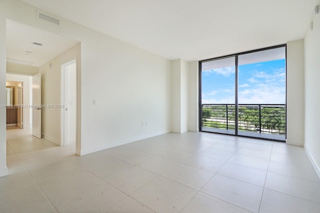 tiled empty room with expansive windows