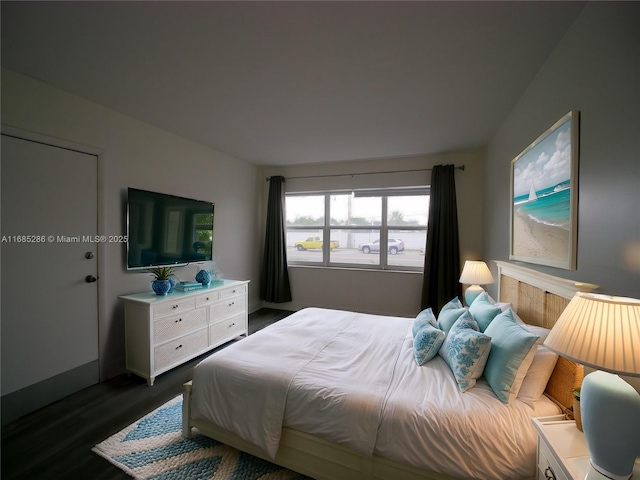 bedroom featuring dark wood-style flooring