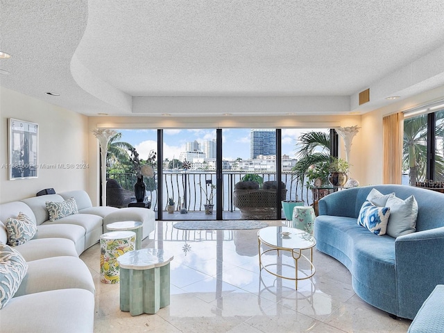 living room with plenty of natural light and a textured ceiling