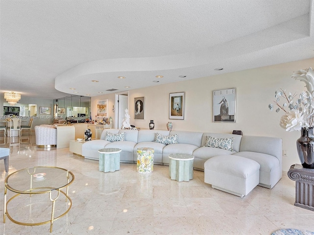 living room with a textured ceiling