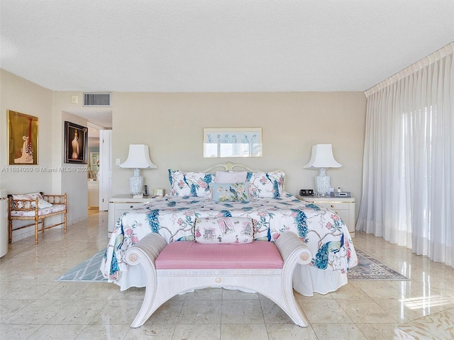 bedroom featuring a textured ceiling