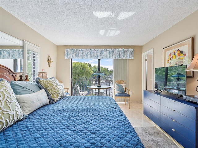 tiled bedroom with multiple windows, a textured ceiling, and access to outside