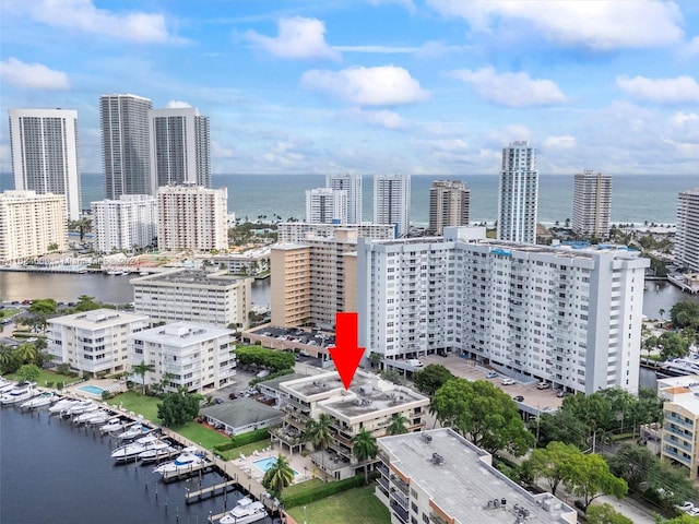 birds eye view of property featuring a water view