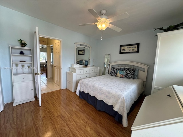 bedroom featuring wood-type flooring and ceiling fan