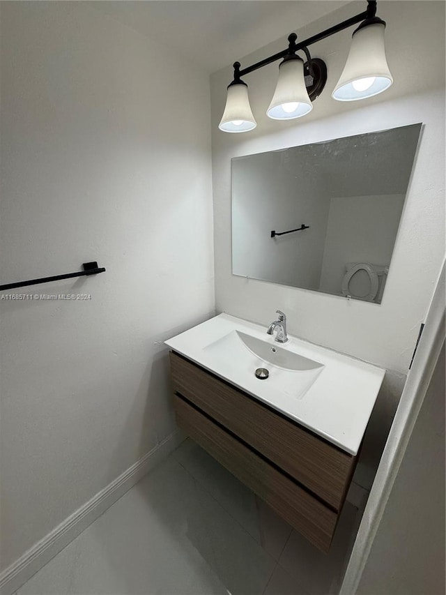 bathroom featuring vanity and concrete flooring