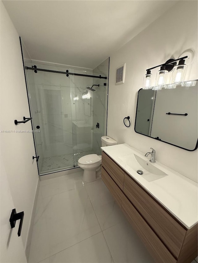 bathroom featuring toilet, an enclosed shower, and vanity