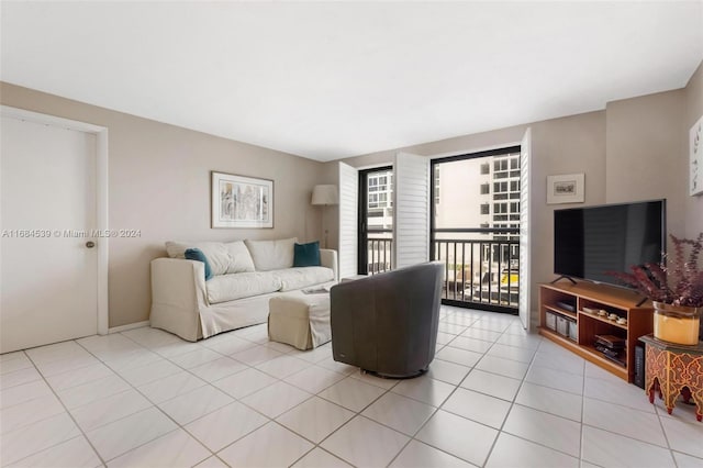3100 NE 48th St Unit 210, Fort Lauderdale, FL 33308 - living room featuring light tile patterned flooring