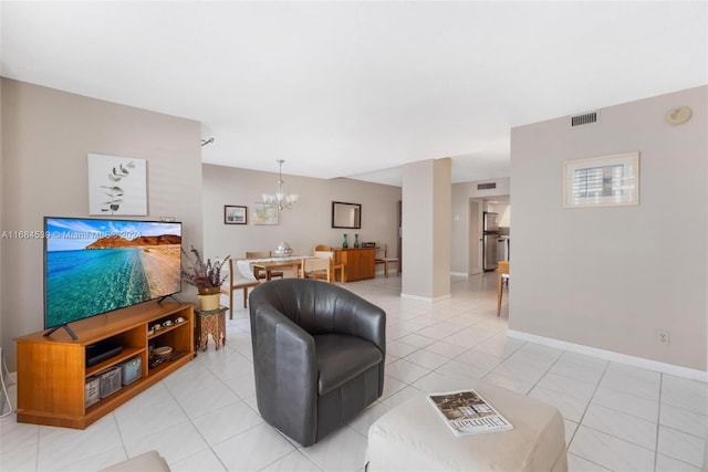 3100 NE 48th St Unit 210, Fort Lauderdale, FL 33308 - living area featuring a chandelier, light tile patterned floors, and baseboards