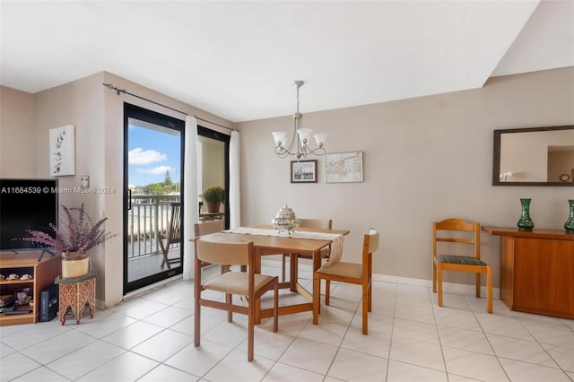 tiled dining space with a notable chandelier