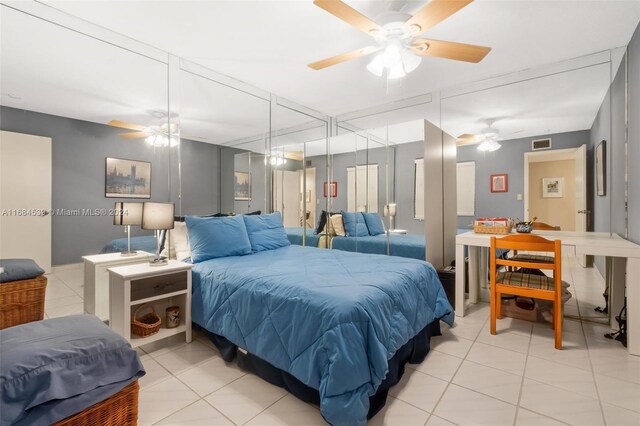 3100 NE 48th St Unit 210, Fort Lauderdale, FL 33308 - bedroom with light tile patterned flooring, ceiling fan, and a closet