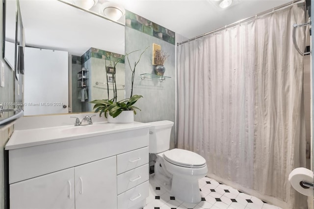 3100 NE 48th St Unit 210, Fort Lauderdale, FL 33308 - bathroom with toilet, vanity, and tile patterned floors