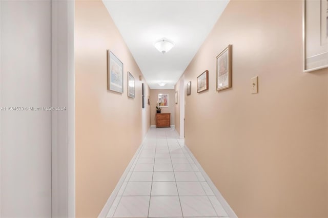 corridor featuring light tile patterned floors