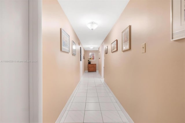 3100 NE 48th St Unit 210, Fort Lauderdale, FL 33308 - corridor featuring light tile patterned flooring and baseboards