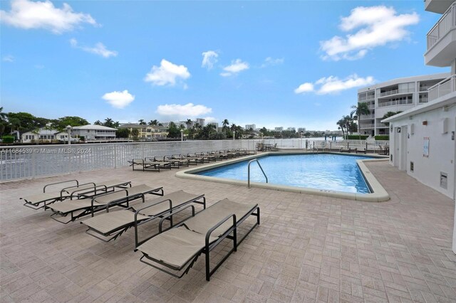 3100 NE 48th St Unit 210, Fort Lauderdale, FL 33308 - community pool featuring a patio