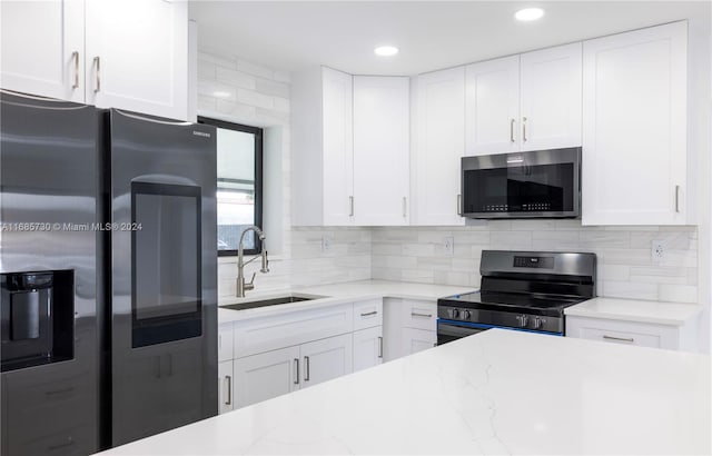 kitchen featuring white cabinetry, appliances with stainless steel finishes, and sink