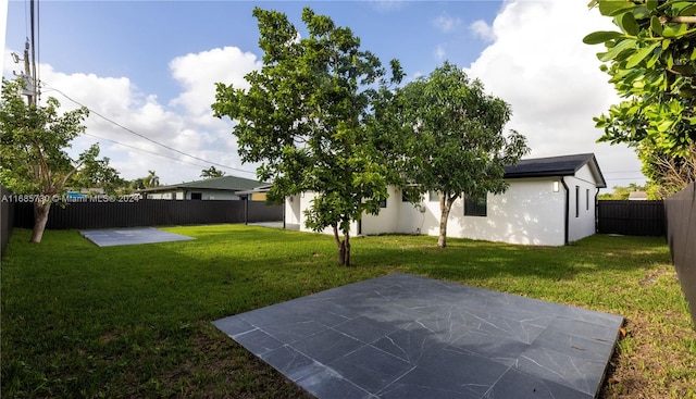 view of yard with a patio area