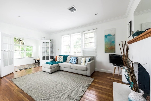 living room with crown molding and dark hardwood / wood-style flooring