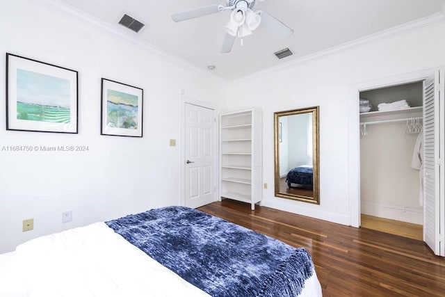 bedroom with ceiling fan, ornamental molding, and dark hardwood / wood-style floors