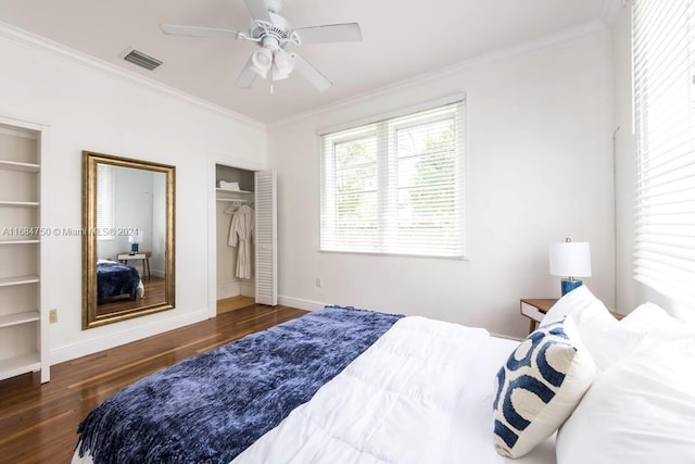 bedroom featuring ornamental molding, dark hardwood / wood-style floors, a closet, and ceiling fan