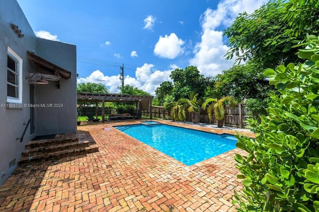 view of pool with a patio area and a pergola