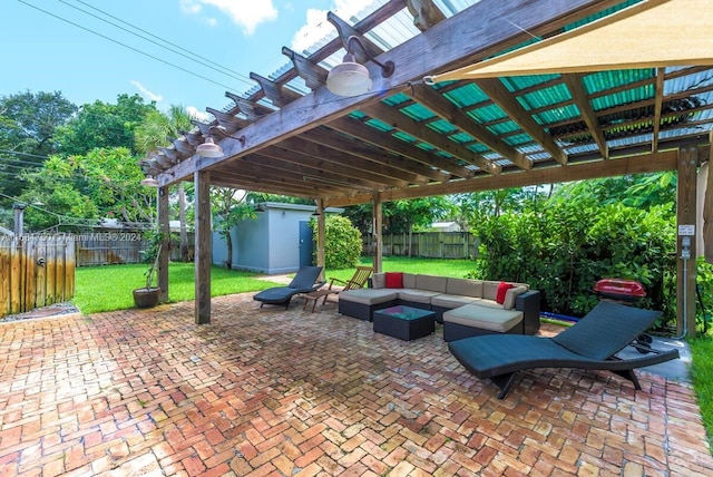 view of patio / terrace featuring an outdoor hangout area, a storage unit, and a pergola