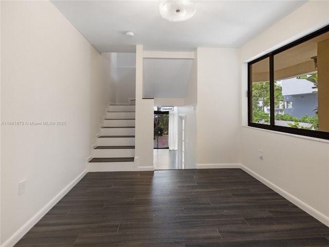 spare room featuring wood-type flooring