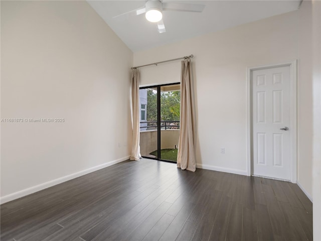 empty room with ceiling fan, lofted ceiling, and dark hardwood / wood-style flooring