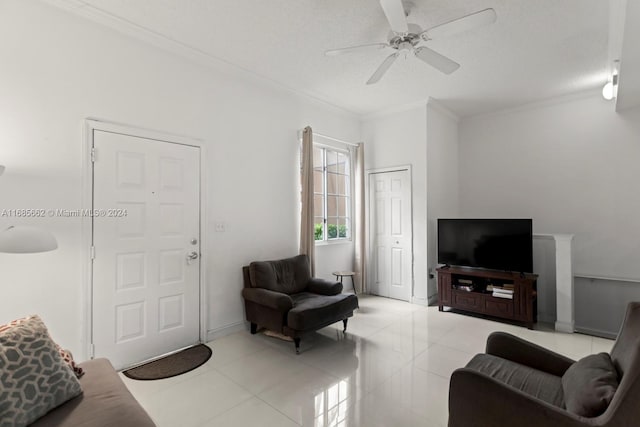 tiled living room with ornamental molding, a textured ceiling, and ceiling fan