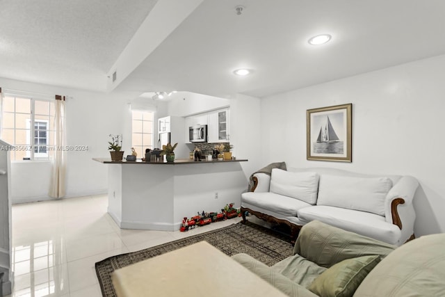 living room with light tile patterned floors