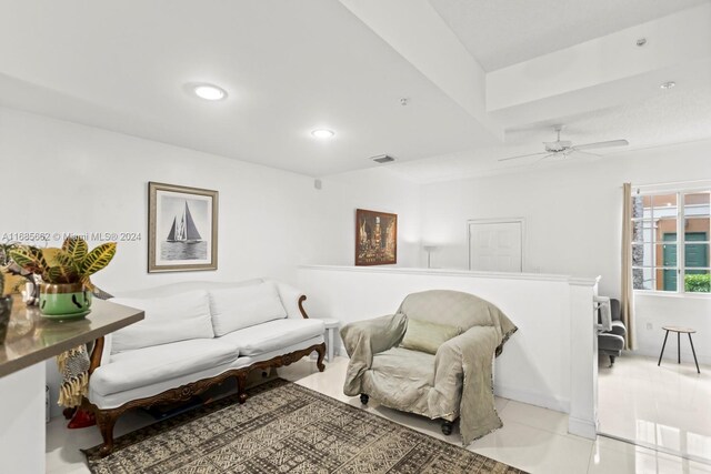 living room featuring ceiling fan and light tile patterned floors