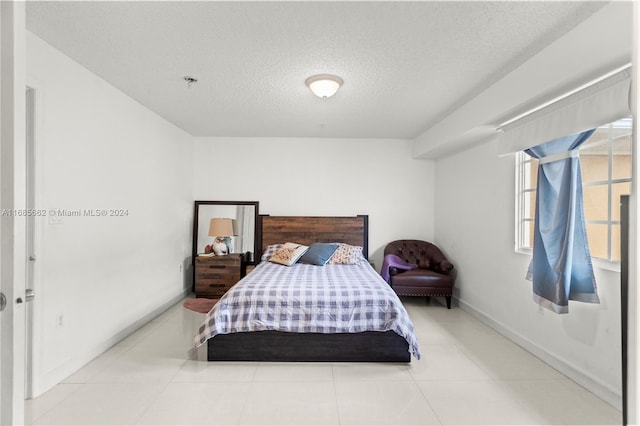 bedroom featuring a textured ceiling