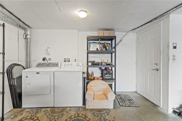 laundry area with independent washer and dryer