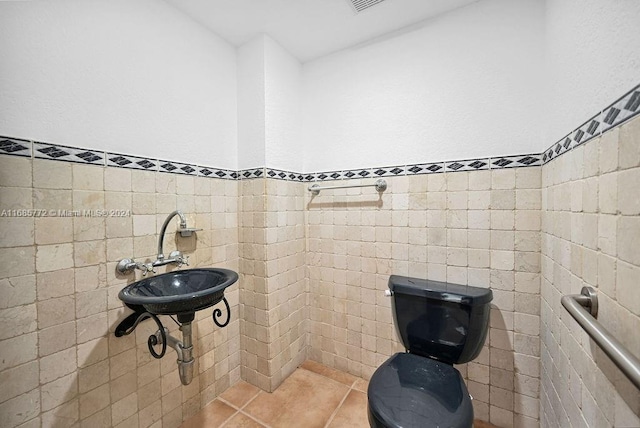 bathroom featuring tile walls and tile patterned flooring