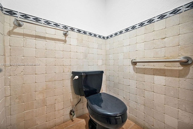 bathroom with toilet and tile patterned flooring