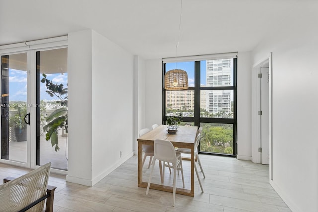 dining area with a wall of windows