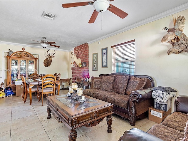 710 E 39th St, Hialeah, FL 33013 - living area featuring a ceiling fan, crown molding, healthy amount of natural light, light tile patterned floors, and a fireplace