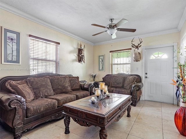 living room with crown molding, a textured ceiling, light tile patterned flooring, and ceiling fan