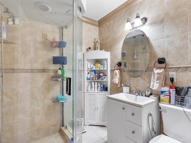 bathroom with toilet, an enclosed shower, vanity, and tile walls