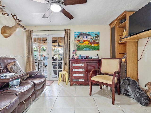 interior space with french doors, ceiling fan, and light tile patterned floors