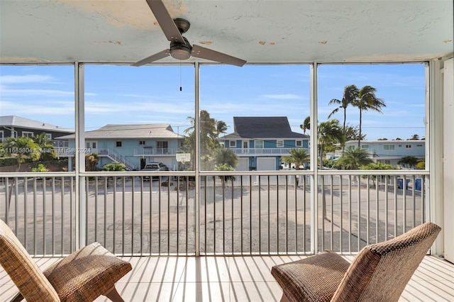 exterior space featuring ceiling fan and plenty of natural light