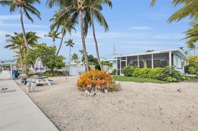 view of yard with a sunroom