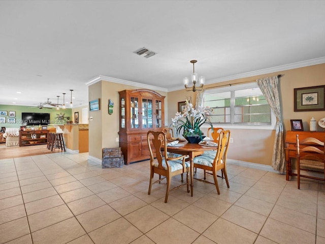 dining area with ornamental molding, light tile patterned floors, and ceiling fan with notable chandelier